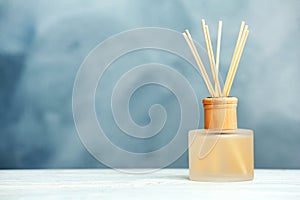 Aromatic reed freshener on table