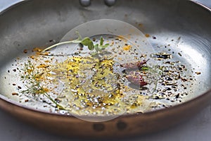 Aromatic Seasonings and Olive Oil in Frying Pan