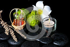 Aromatic spa concept of bottles essential oil, bergamot fruits