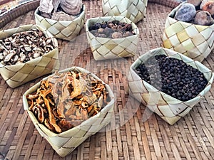 Aromatic spices in coconut weave and bamboo weave. spices, herbs,soft focus