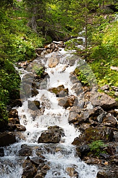 Arosa, Switzerland, August 15, 2021 Alpine waterfall in the mountains