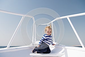 Around world. Child cute sailor on yacht sunny day. Adventure of boy sailor travelling sea. Boy adorable sailor striped