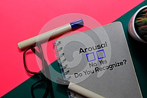 Arousal, Do You Rezognize? Yes or No. On office desk background