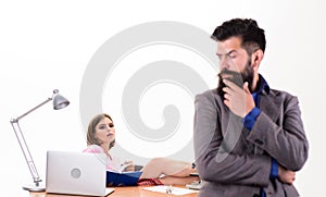 Aroused by female colleague. Office collective concept. Manager boss stand in front of girl busy with laptop. Office