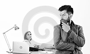 Aroused by female colleague. Office collective concept. Manager boss stand in front of girl busy with laptop. Office