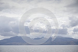 Arran viewed from Rothesay in Isle of Bute under dark clouds