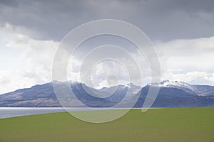 Arran viewed from Rothesay in Isle of Bute under dark clouds