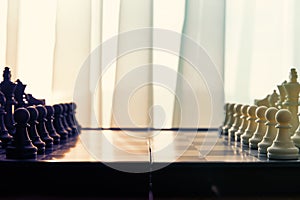 An arranged chessboard with black and white pieces