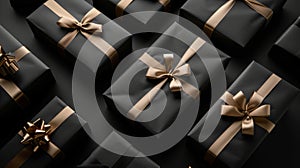Arranged present gifts boxes wrapped in black paper with gold ribbon