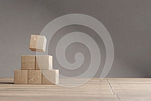 Arranged wood cube stacking as shape, mock up for create symbol, business growth and management concept