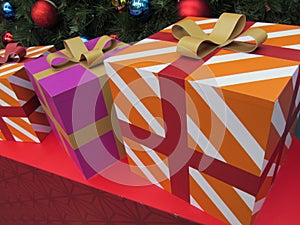 An arrangement of decoration gift boxes under a Christmas tree