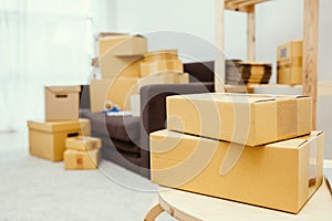 Arrangement of empty cardboard packing boxes standing on a floor photo