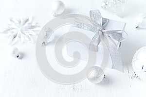 An arrangement of gift boxe and Christmas decorations on white background. Symbolic image. Close up. Copy space