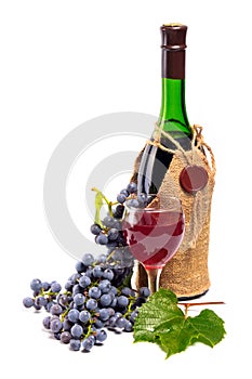 Arrangement of grapes with a bottle of wine and gl