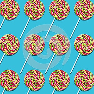 Arrangement of lollipop candies on turquoise background