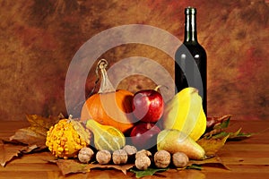 Arrangement of pumpkins, autumn fruits and wine