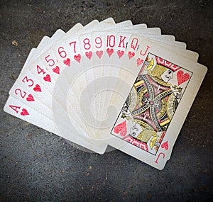 Arrangement of red colour playing cards