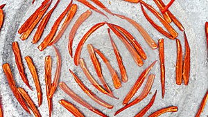 Arrangement of red peppers for drying