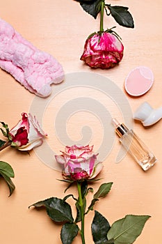 Arrangement of rose flowers and beauty tools and treatment