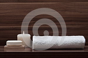 Arrangement of soap, towel and candle