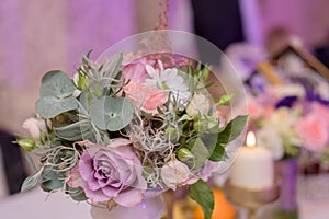 Arrangement for table with flowers and candles