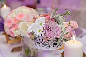 Arrangement for table with flowers and candles