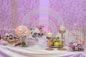 Arrangement for table with fruits, flowers and candles