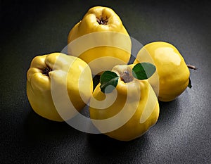 Arrangement of three fresh yellow quinces