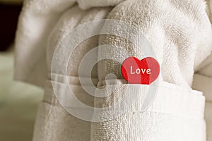 Arrangement of towels and a heart symbol of love room decoration wedding newlyweds