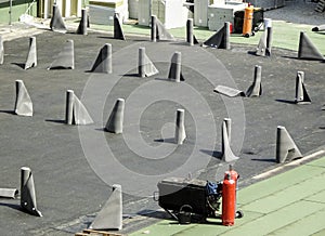 Arrangement of waterproofing membranes  rolls on a construction site