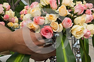 Arranging a bouquet of roses