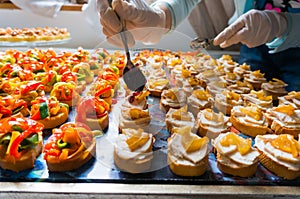 Arranging catering food specialities photo