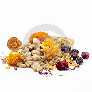 Array of dried herbs and spices is displayed on a white background