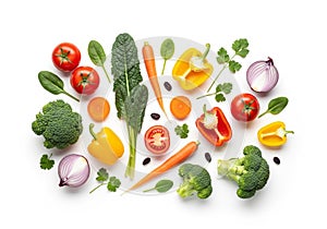 An array of fresh vegetables on a white background. Includes whole and sliced