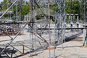 An array of ground supports, trusses, and insulators at an electrical power substation