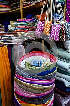 Array of handcrafted textile items in a market in Tangier, Morocco