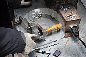 An array of needles and elements in the mold.