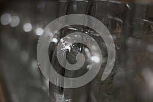 array of transparent glass beer mugs at a bavarian folk festival or fairy ready for fillup with beer