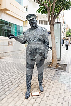 Statue of film actor Heraclio Niz Mesa in the uniform of a police officer by sculptor Rigoberto Camacho Perez