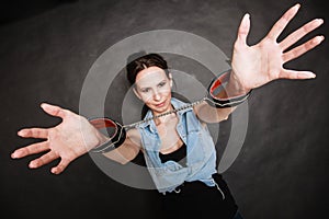 Arrest. Criminal woman prisoner showing handcuffs