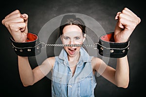 Arrest. Criminal woman prisoner showing handcuffs