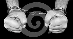 Arrest, hands with handcuffs. photo