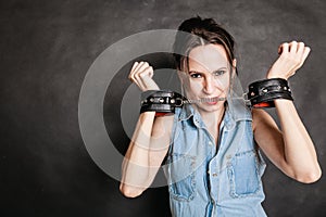 Arrest and jail. Criminal woman prisoner girl in handcuffs