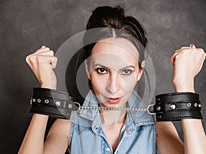 Arrest and jail. Criminal woman prisoner girl in handcuffs