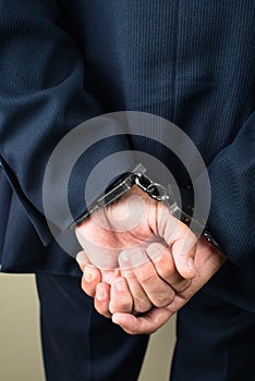 arrested businessman in handcuffs. Businessman bribetaker or bri