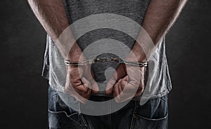 Arrested criminal with handcuffs on