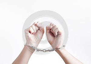 Arrested criminal hands in handcuffs
