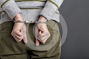 An arrested man with handcuffs