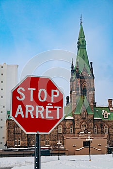 Arret stop sign over Canadian Parliament building in Ottava photo