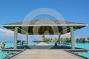 Arrival pier with a roof at the tropical island